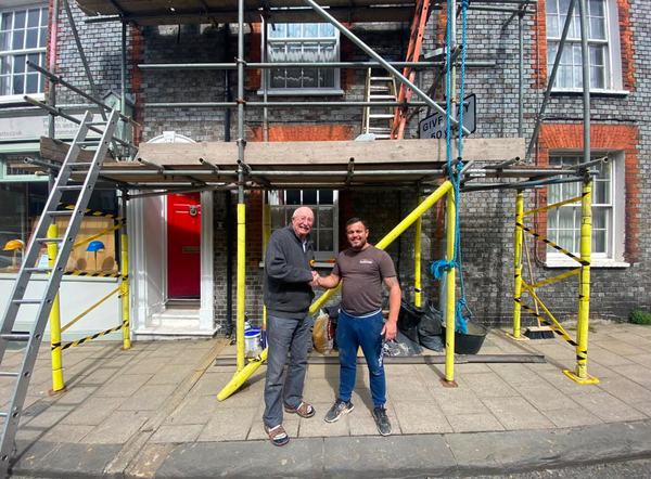 Albert with happy customer in front of completed scaffolded property
