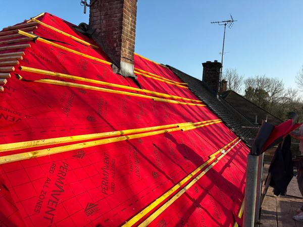 New pitched roof with Permavent red breathable membrane and battens