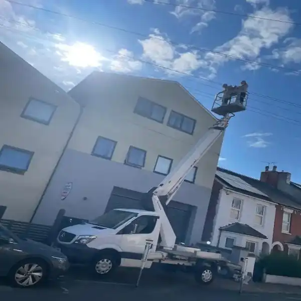 ROOF2ROOF team working from a cherry picker on a three storey property